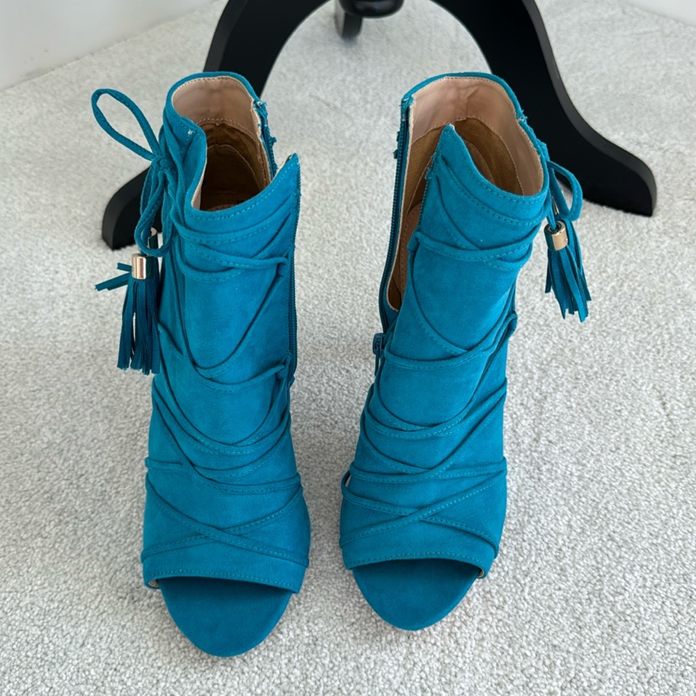Teal colored booties. Size 8